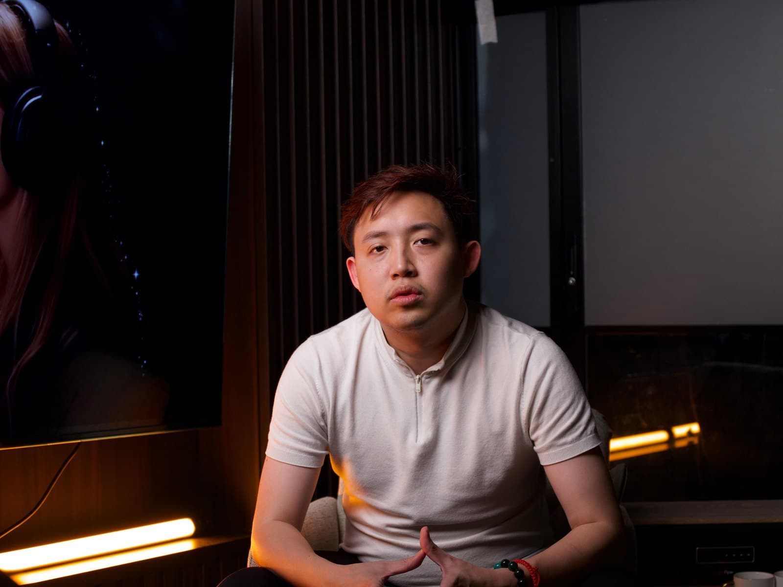 A creator seated on the Bang Bang Bang studio set