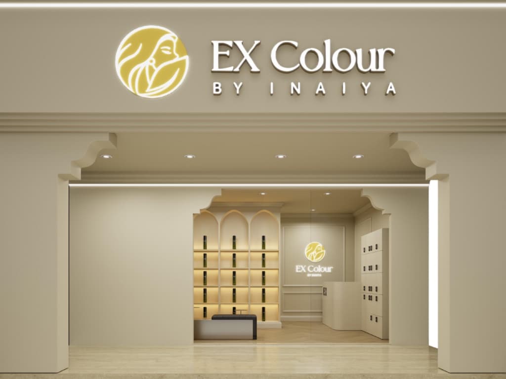 The Ex Colour by Inaiya shopfront, lit signage over a cream facade