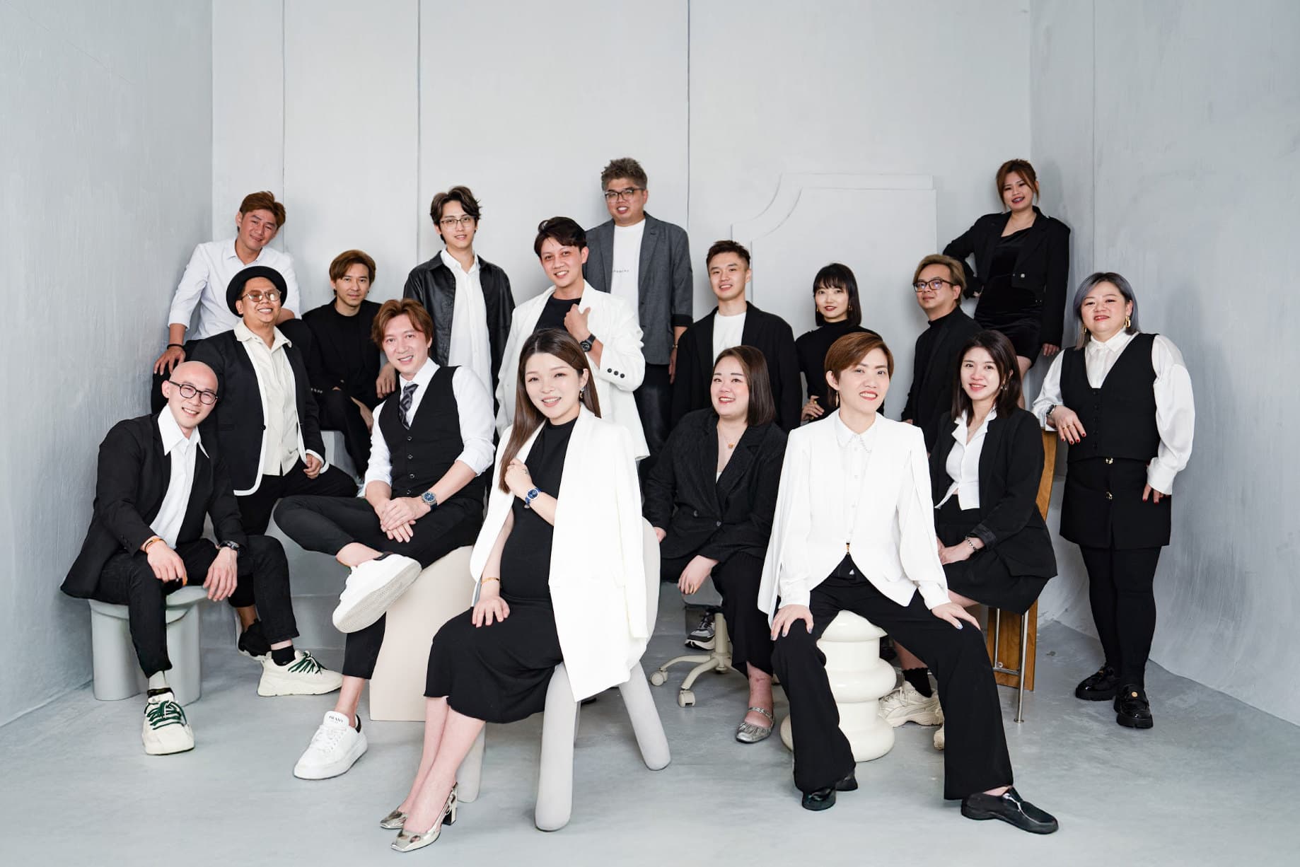 The people of EX Group photographed together in the studio